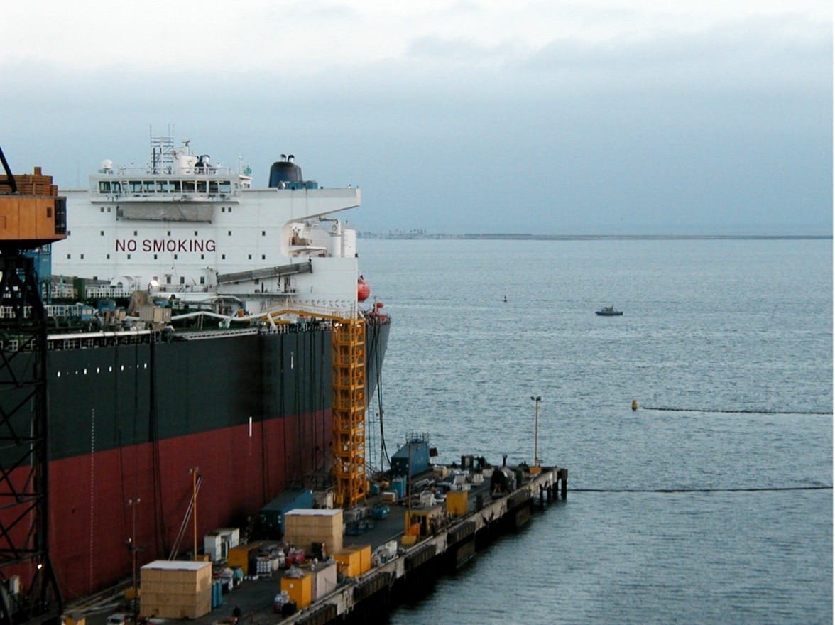 cargo ship docked at pier